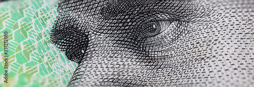Macro Photography of the eyes of AB 'Banjo' Paterson on the 10 Dollar Australia banknote. Extreme close up to a Australian 10 dollars note. Polymer currency of the Reserve Bank of Australia