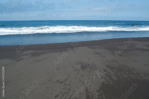 Beach with black volcanic sand on Tenerife island