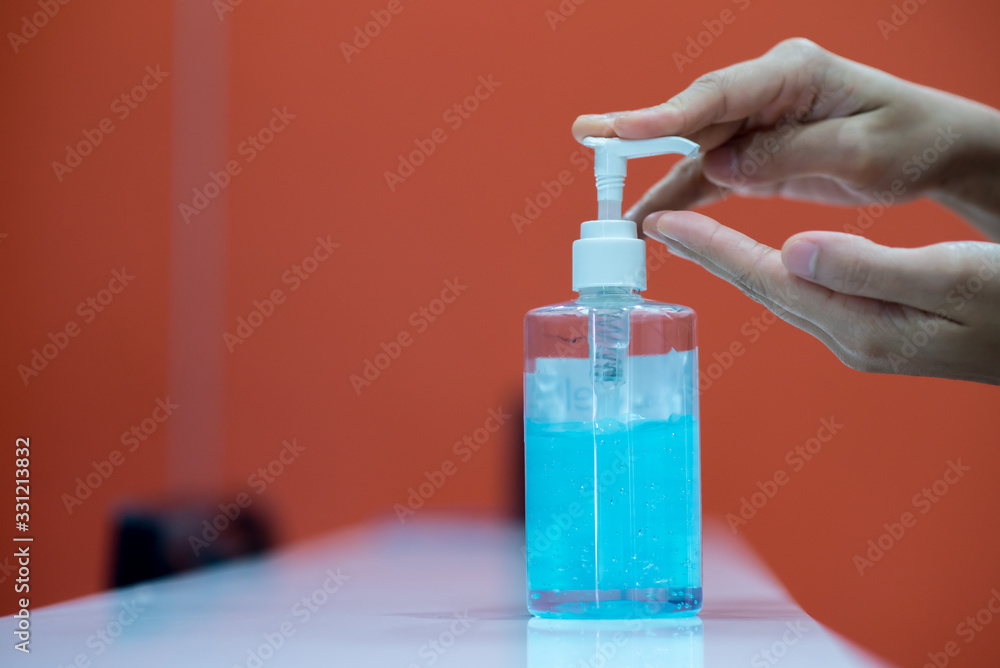 Focus on the hand pressing the alcohol gel from the bottle To clean the palm, to wash hands, clean the virus, the virus, Covid 19 Focus on the hand pressing the alcohol gel from the bottle To clean the palm, to wash hands, clean the virus, the virus, Covid 19
