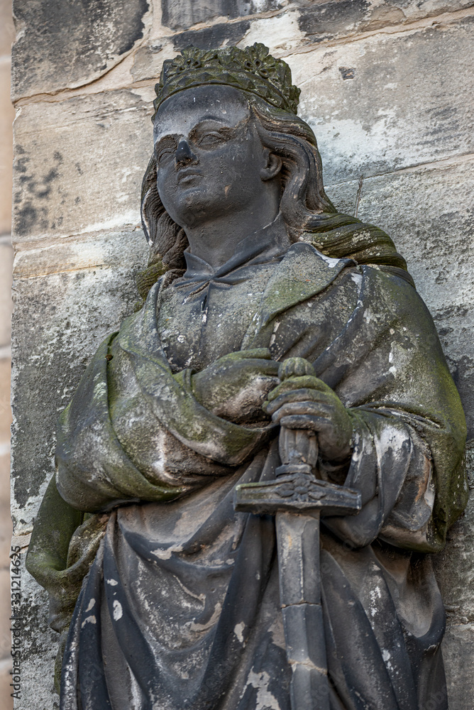 Obraz premium Ancient statue portrait of a princess knight as gatekeeper in Magdeburg Cathedral as Magdeburg, Germany, closeup, details