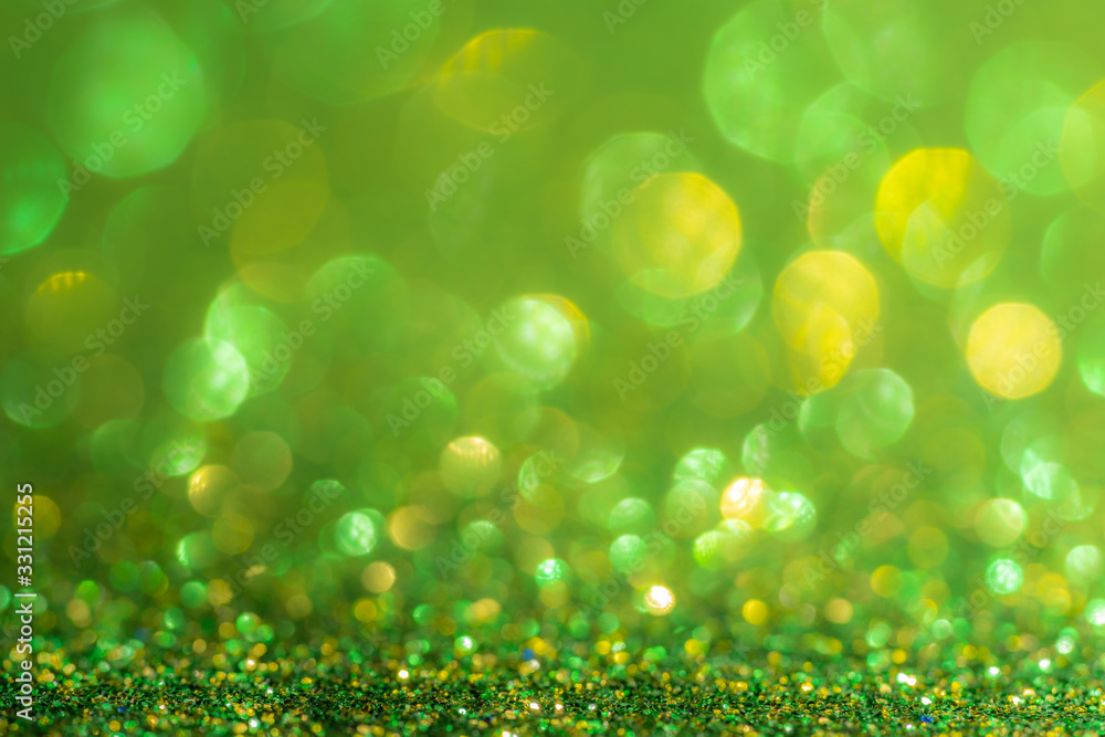 Glitter, sparkle defocused blurred green background with bokeh lights