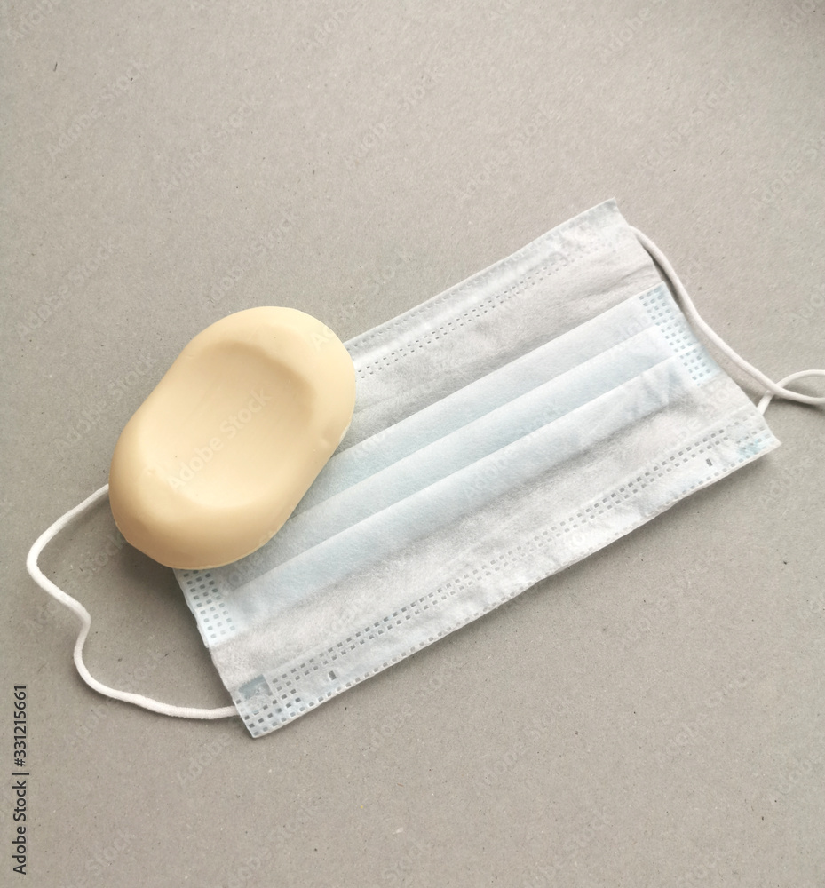 Fototapeta premium Medical disposable masks and soap to protect against the virus.Prevention of coronavirus.Remedies.Hygiene products.