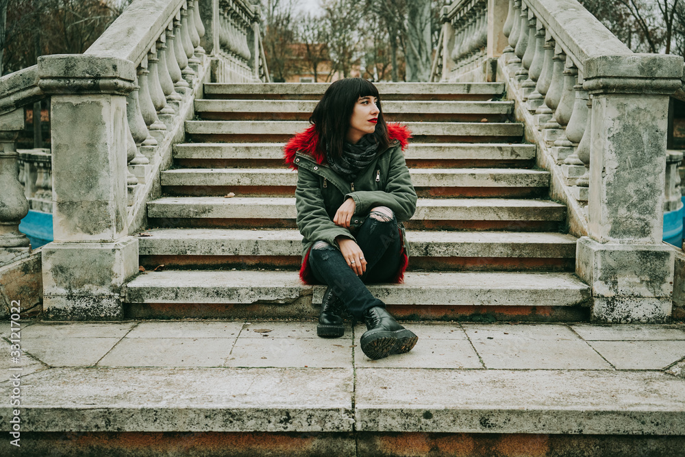 Young cool woman with ghotic style in an urban place Young cool woman with ghotic style in an urban place