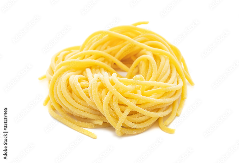 Fresh uncooked spaghetti pasta isolated on a white background Fresh uncooked spaghetti pasta isolated on a white background