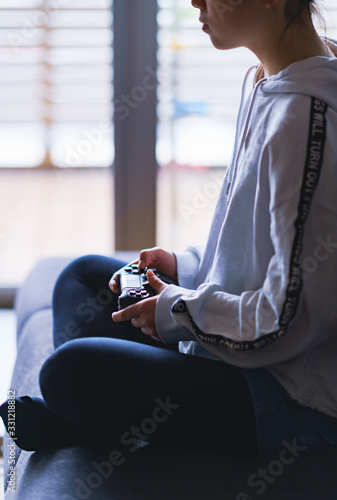 Lifestyle of Japanese girl playing game by using wireless controller 