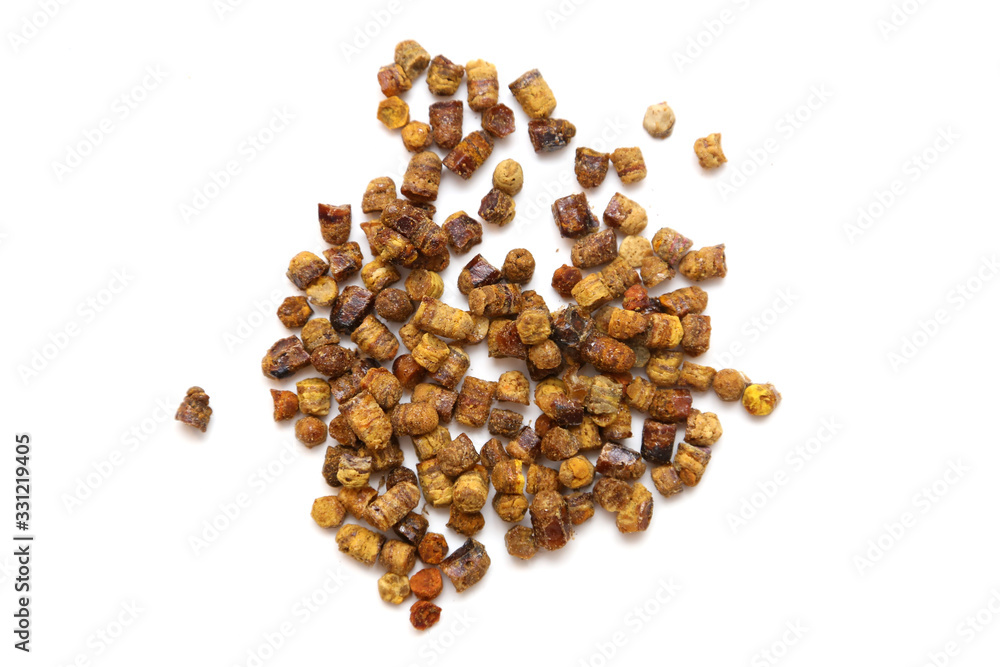 Bee pollen pellet pieces called ambrosia on white background. Bee pollen pellet pieces called ambrosia on white background.