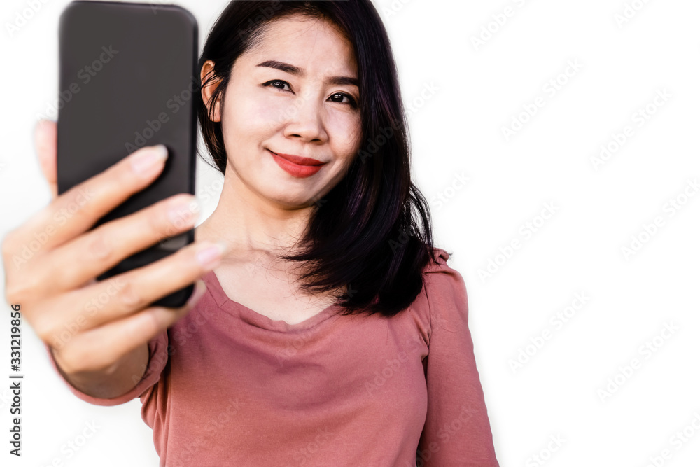 Portrait of beautiful Asian female with black hair making selfie by smart phone Portrait of beautiful Asian female with black hair making selfie by smart phone