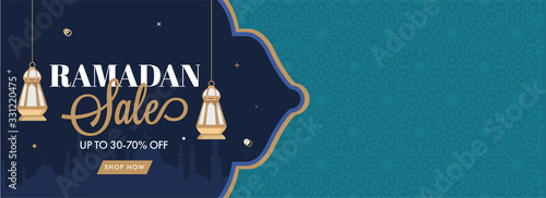Ramadan Sale Header or Banner Design with 30-70% Discount Offer and Hanging Lanterns on Blue and Green Arabic Pattern Background.