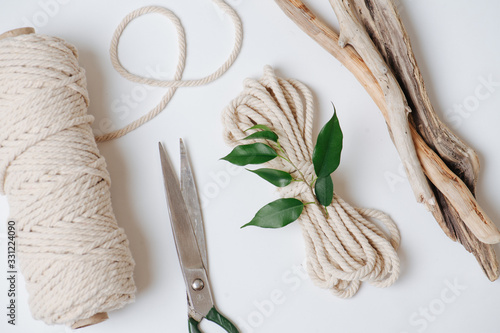 Everything for weaving macrame, rope, scissors and sticks photo