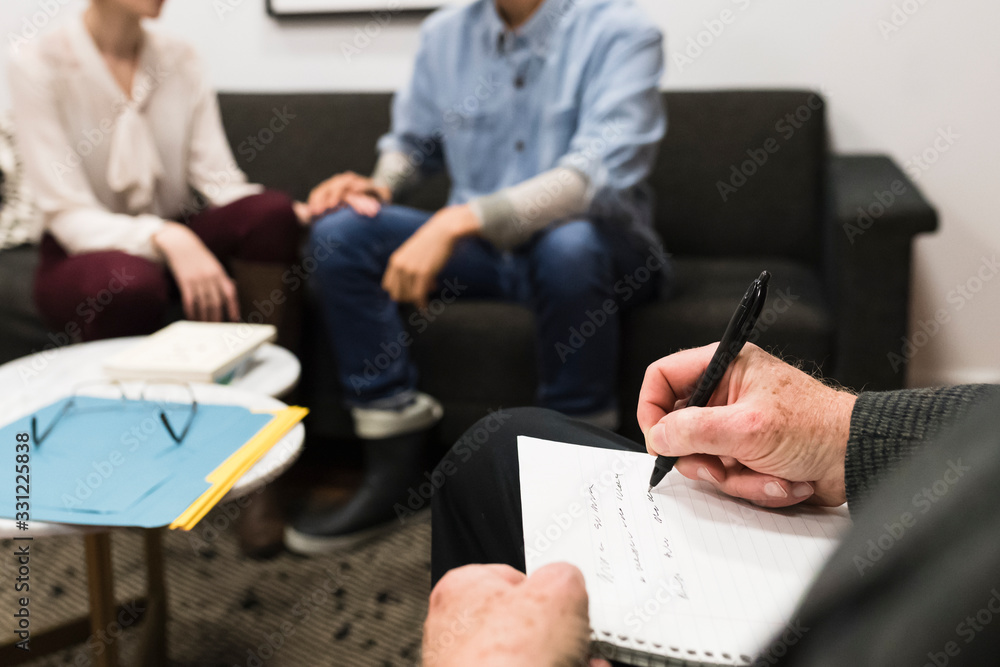 Couple during a therapy session with psychologist Couple during a therapy session with psychologist