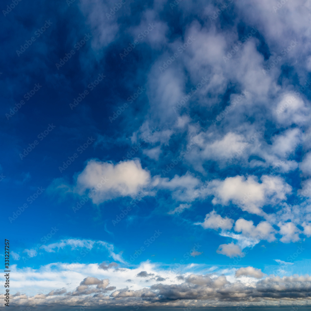 Obraz premium Fantastic clouds against blue sky