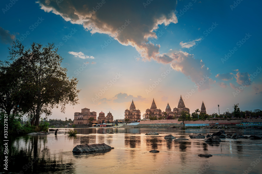 Sunset view of chhatri or canopies at Orchha from across the betwa river in Orchha Madhya Pradesh India.
