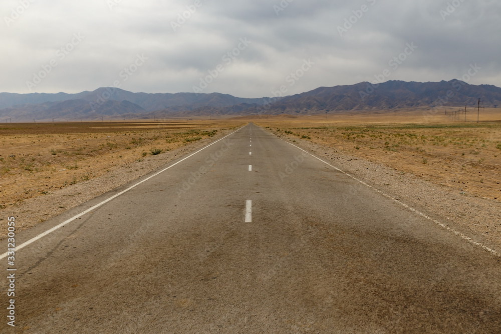 Asphalt road to the Akyrtas palace complex in the Jambyl region of Kazakhstan. Asphalt road to the Akyrtas palace complex in the Jambyl region of Kazakhstan.