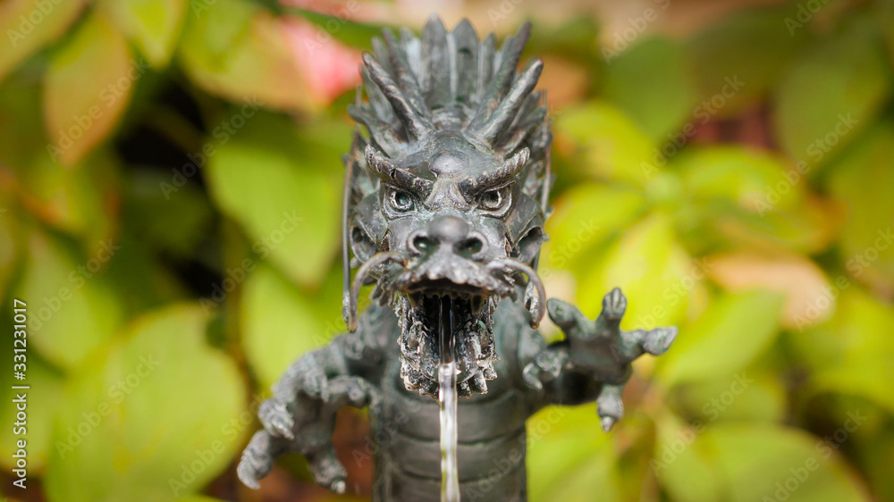 A dragon fountain at the entrace of shinto shrine A dragon fountain at the entrace of shinto shrine