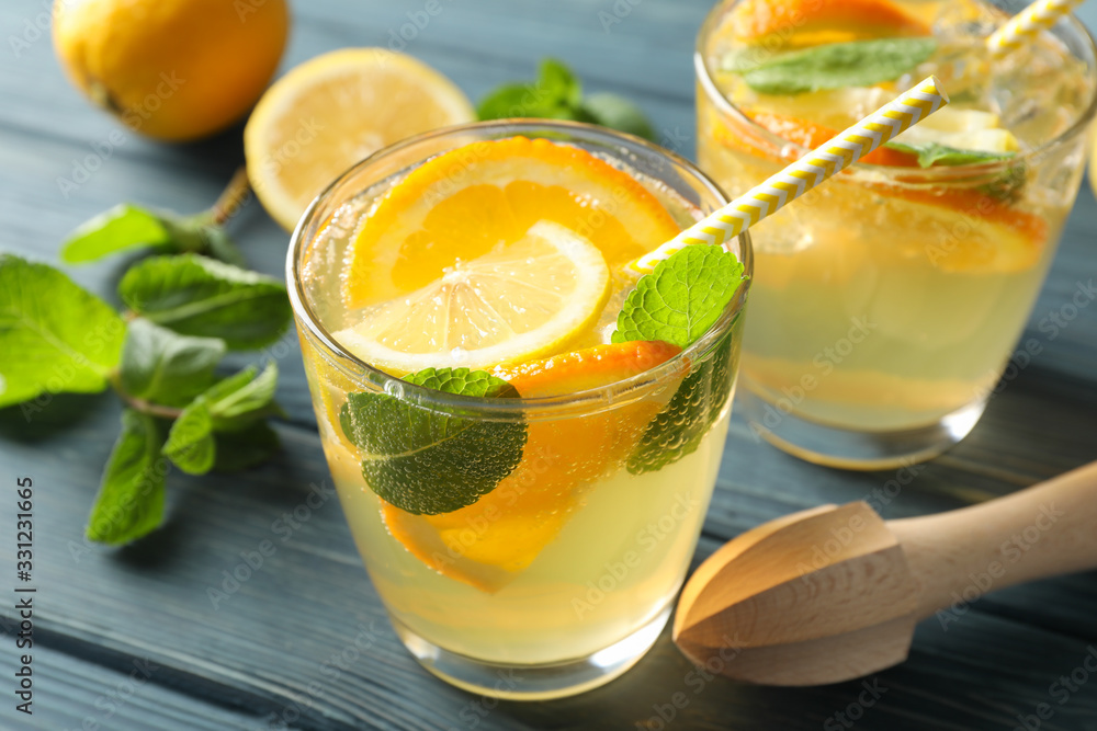 Glasses with lemonade on wooden background, close up Glasses with lemonade on wooden background, close up