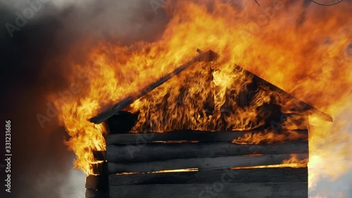 Wooden cabin fire burning and smoking