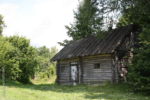 old wooden house in the forest © Evgeniy Bezborodov