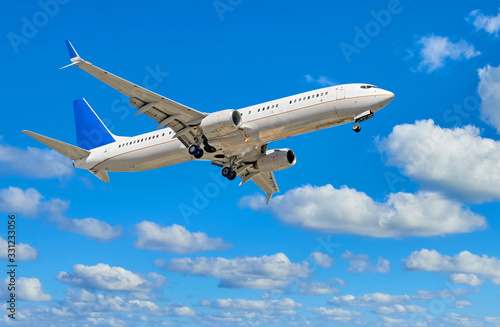 Airplane on cloudy blue sky background including clipping path