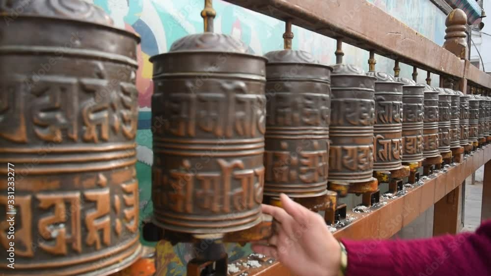 Buddhist 's tibetan's prayer wheels in Kathmandu, Napal Buddhist 's tibetan's prayer wheels in Kathmandu, Napal