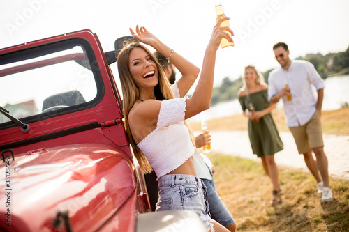 Happy young women drinks ci...