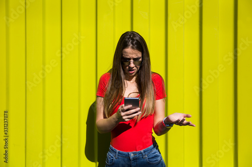 Young woman using mobile ph...
