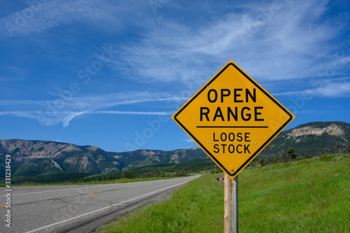 Fototapeta Naklejka Na Ścianę i Meble -  Open Range Sign Warns of Loose Livestock on Road