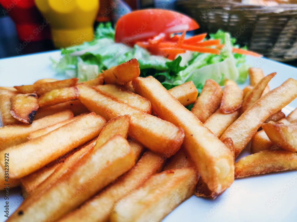 Golden French fries potatoes ready to be eaten Golden French fries potatoes ready to be eaten