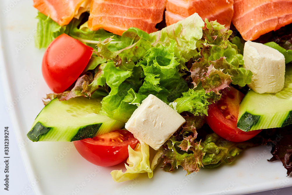 Healthy vegetable salad with smoked salmon. Buddha bowl, dieting concept Healthy vegetable salad with smoked salmon. Buddha bowl, dieting concept