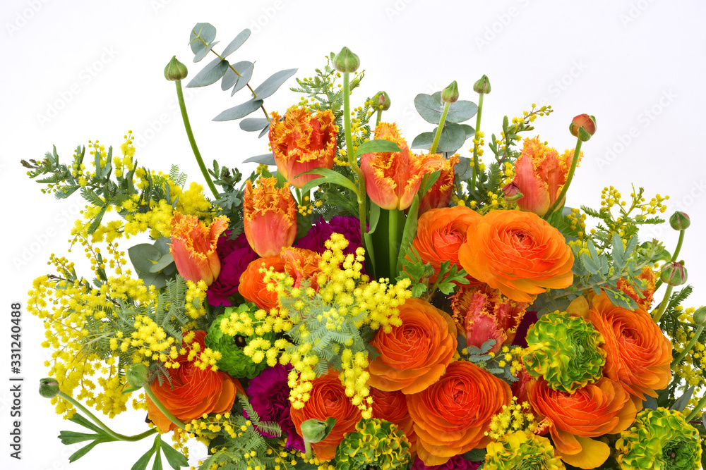 Obraz premium Flower arrangement on white background : Ranunculus, tulip, mimosa, eucalyptus, carnation, dracaena