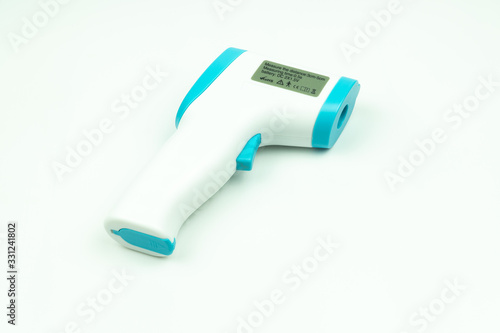 Non-contact infrared thermometer isolated on white background to measure a body temperature.