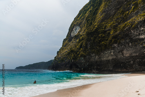 Amazing panoramic view of tropical beach  sea rocks and turquoise ocean  blue sky. Atuh beach  Nusa Penida island  island of Bali  Indonesia. Travel concept. Manta Bay or Kelkinkin Beach