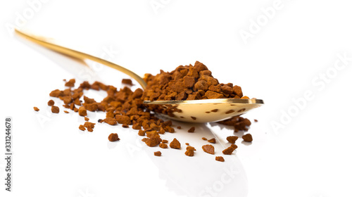 nstant coffee in the spoon on white background