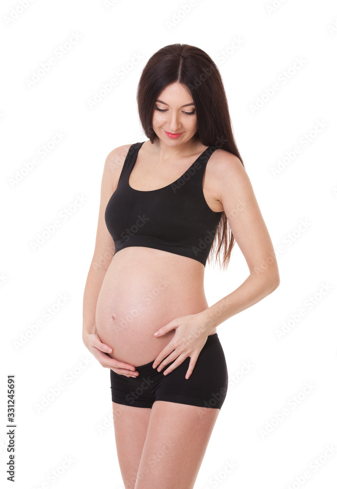 Image of pretty pregnant woman touching her big belly. Close up. Motherhood, pregnancy, people and expectation concept. Pregnant woman in black lingerie expecting baby. Isolated on white Image of pretty pregnant woman touching her big belly. Close up. Motherhood, pregnancy, people and expectation concept. Pregnant woman in black lingerie expecting baby. Isolated on white