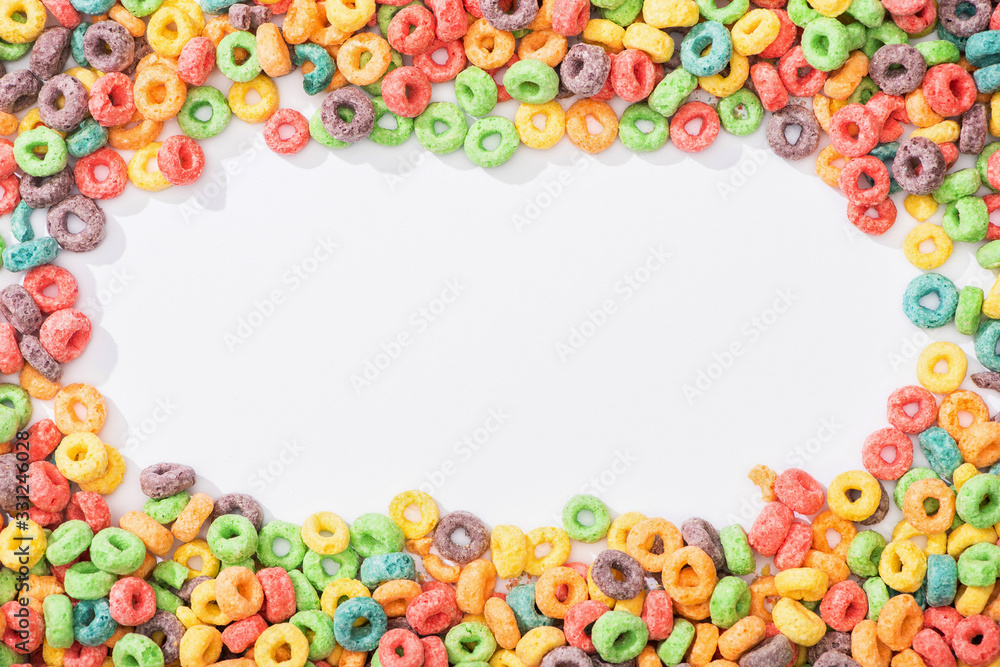 top view of bright multicolored breakfast cereal arranged in frame on white background top view of bright multicolored breakfast cereal arranged in frame on white background