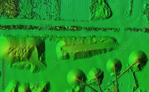 DEM - digital elevation model. Product made after proccesing pictures taken from a drone. It shows excavation site with piles of aggregates photo