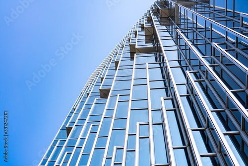 underside panoramic and perspective view to steel blue glass high rise building skyscrapers  business concept of successful industrial architecture