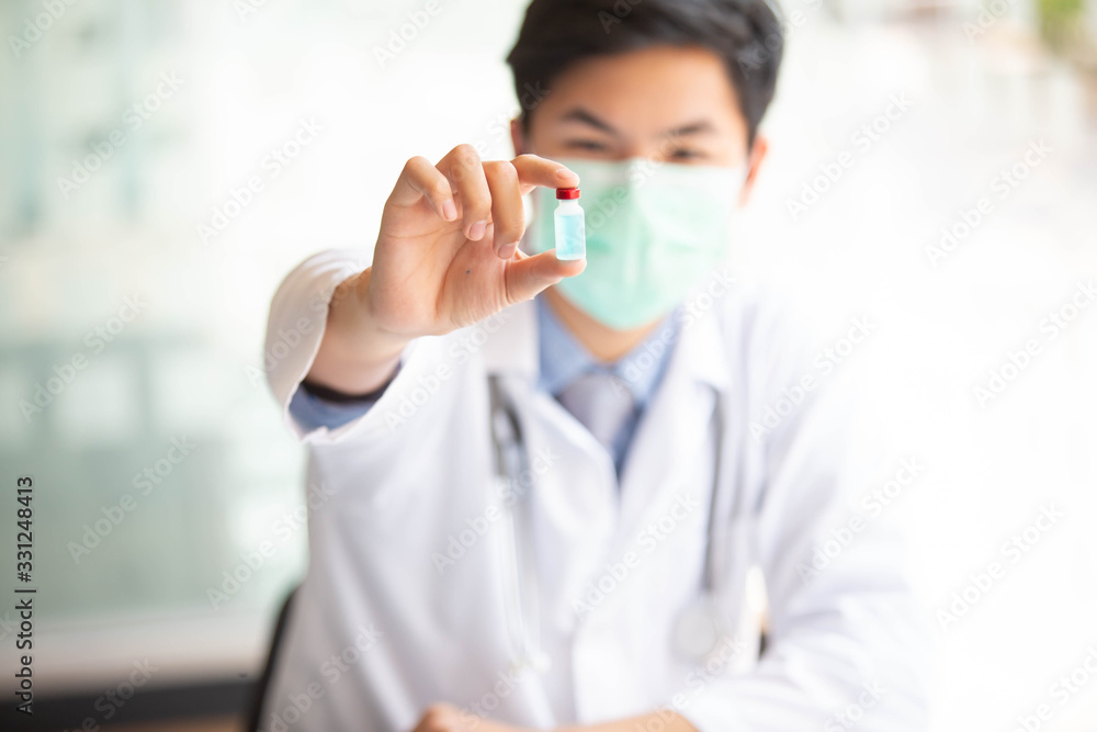 The doctor is testing a sample of biological tubes contaminated by Corona-virus Covid 19 and searching for a vaccine or Syrup against the virus. In the laboratory and film samples of infected lung The doctor is testing a sample of biological tubes contaminated by Corona-virus Covid 19 and searching for a vaccine or Syrup against the virus. In the laboratory and film samples of infected lung
