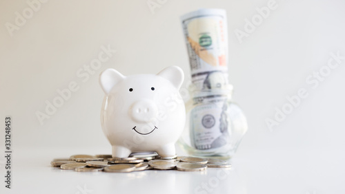 The piggy bank was overflowing and the dollar banknotes included, saving money, accounting and finance concept.