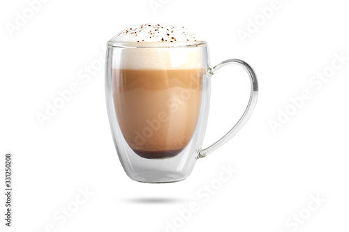  cappuccino with cinnamon on a foam in a transparent cup with a double bottom. isolate on white background