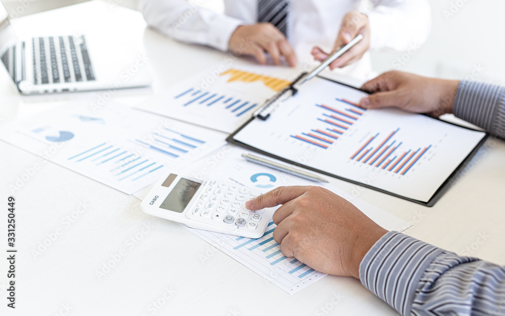 Business team meeting analyze financial graphs market growth reports And corporate income tax, Analysis of financial accounting and real estate investment concept.. Business team meeting analyze financial graphs market growth reports And corporate income tax, Analysis of financial accounting and real estate investment concept..