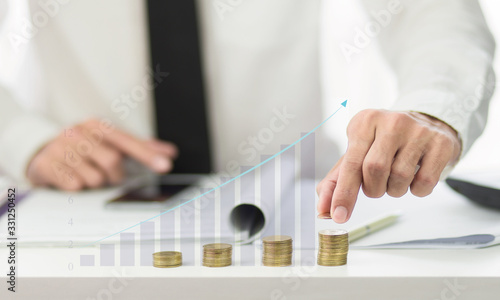 Investment growth concept with financial graph and stack of coins