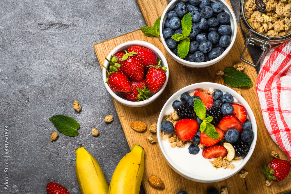 Greek yogurt granola with fresh berries . Greek yogurt granola with fresh berries .