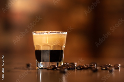 tasty coffee shot on wooden bar table
