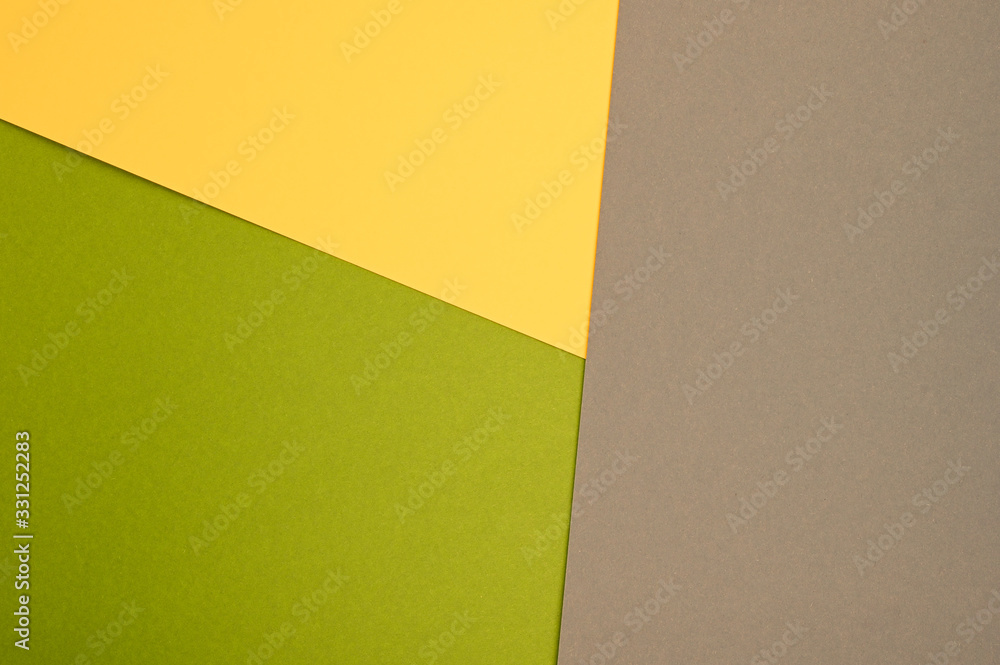 Color paper composition. Top view background, minimal concept, flat lay: taupe, goldenrod and olive