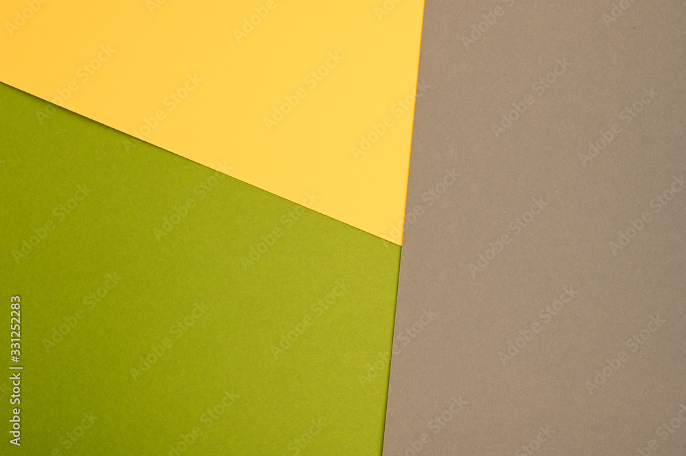Color paper composition. Top view background, minimal concept, flat lay: taupe, goldenrod and olive Color paper composition. Top view background, minimal concept, flat lay: taupe, goldenrod and olive