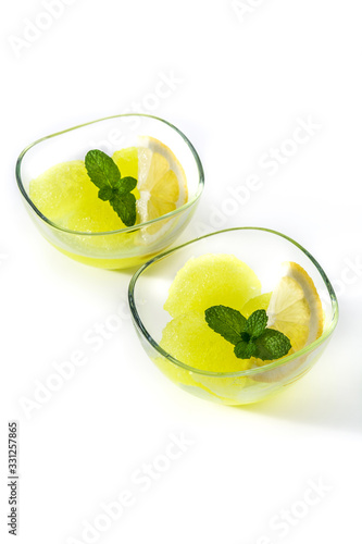 Lemon sorbet with mint in glasses isolated on white background
