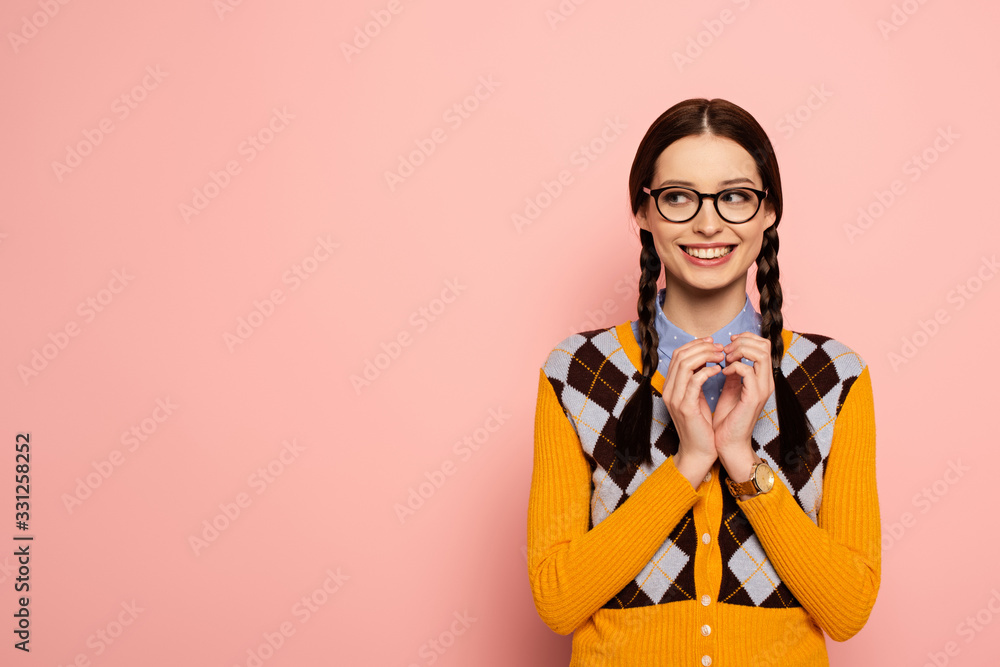 cunning female nerd in eyeglasses gesturing on pink cunning female nerd in eyeglasses gesturing on pink