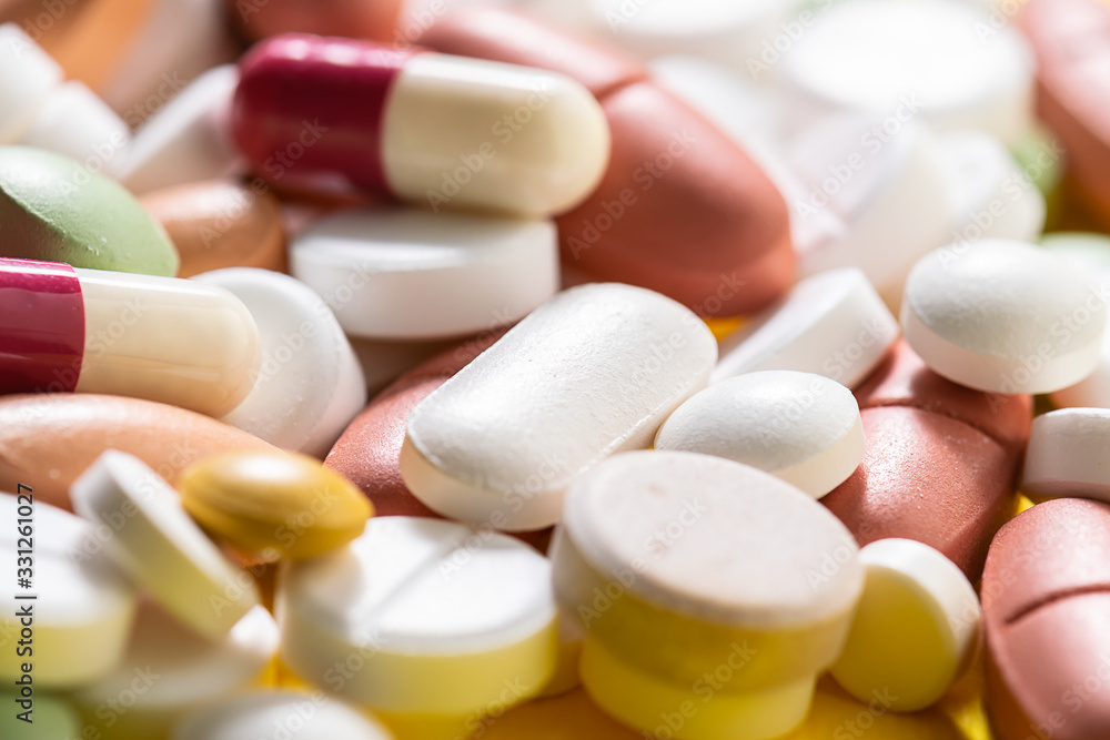 Assortment of medical pills, tablets and capsules macro view. Health care and treatment concept. Assortment of medical pills, tablets and capsules macro view. Health care and treatment concept.
