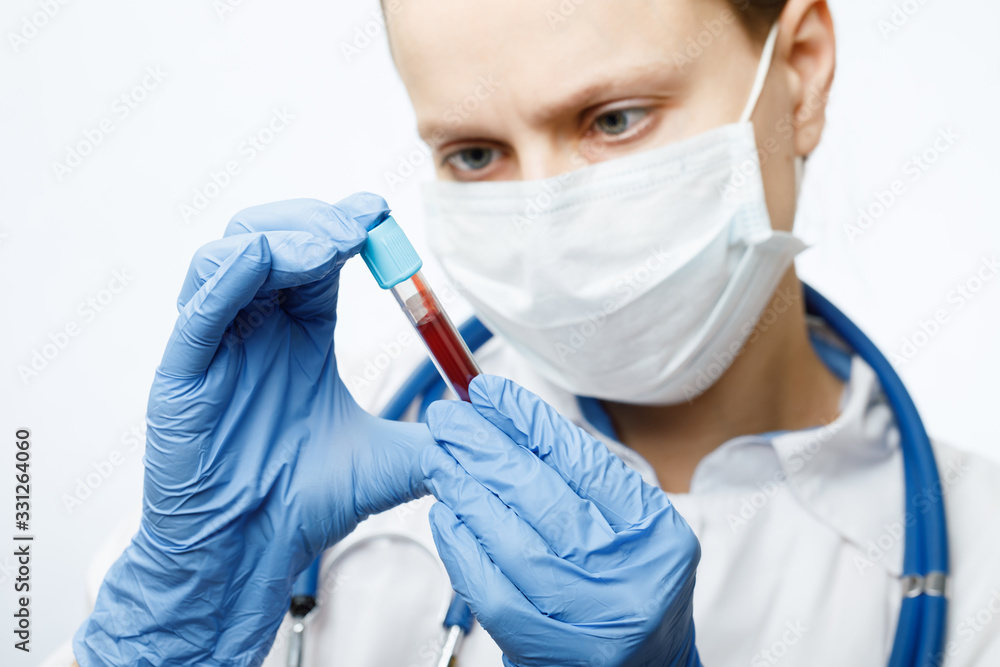 Doctor holding blood test tube Doctor holding blood test tube
