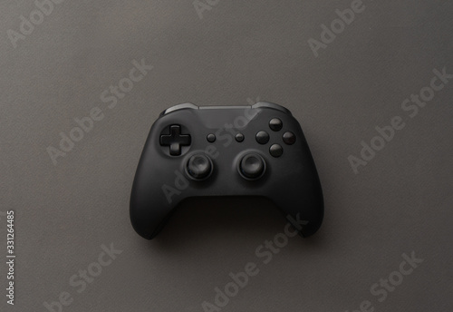 Minimalistic black: close-up of the gamepad on a black background.